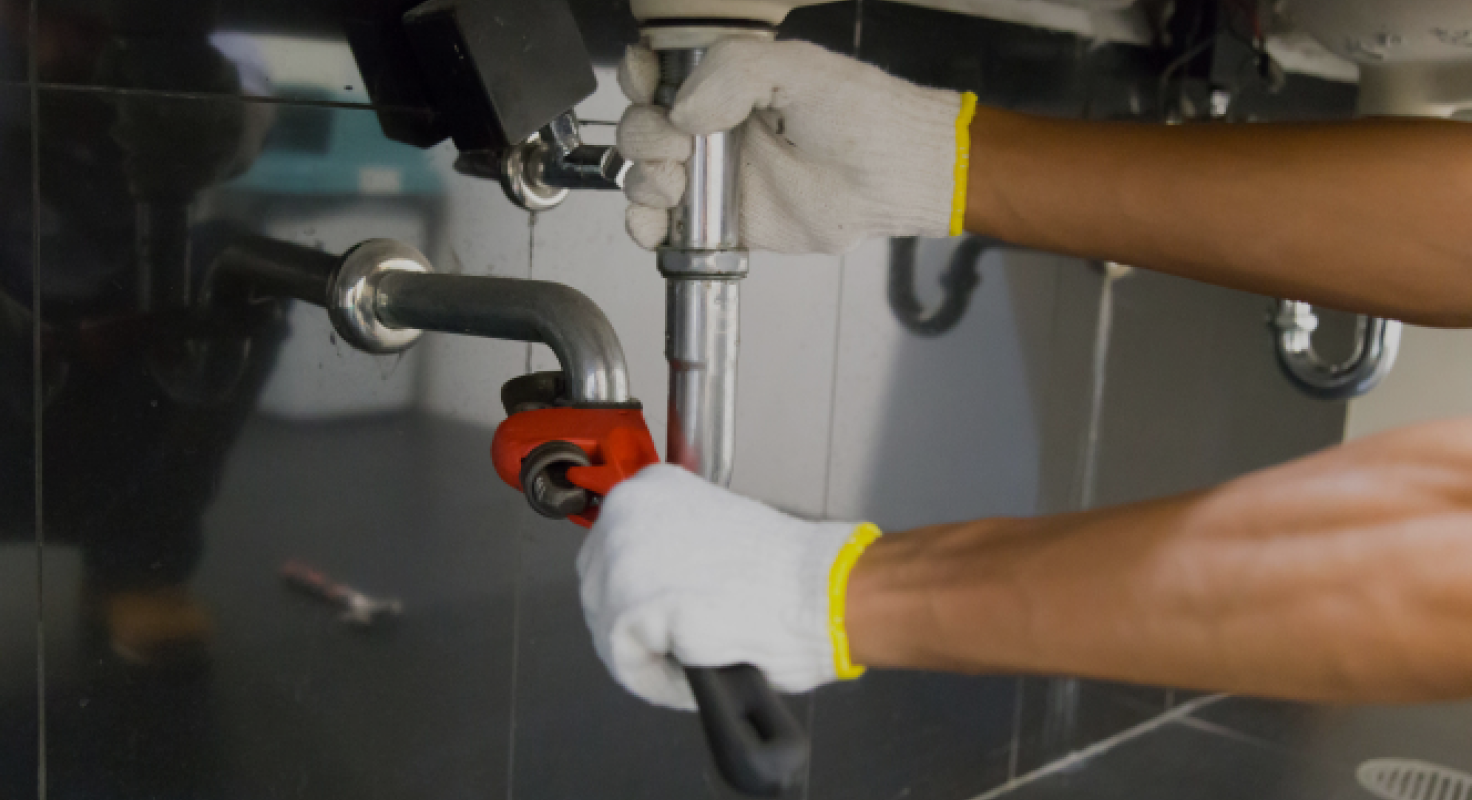 Plumber Fixing Pipe