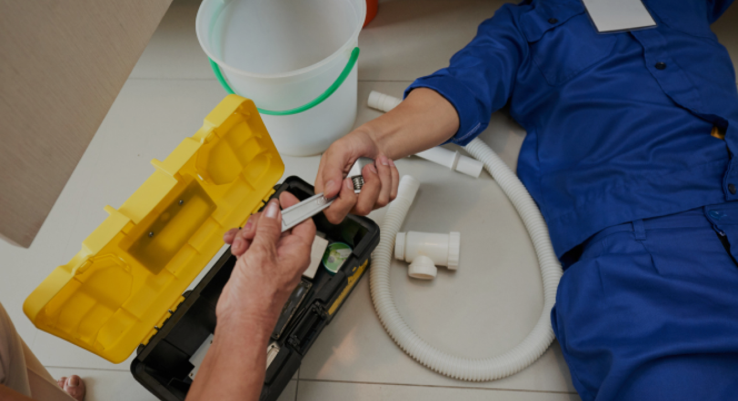 Plumber Fixing Pipe