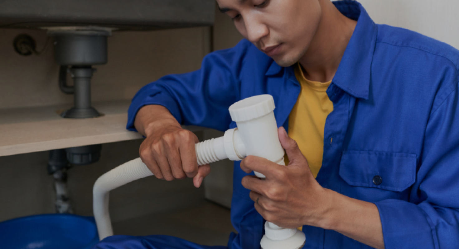 Plumber Fixing Pipe
